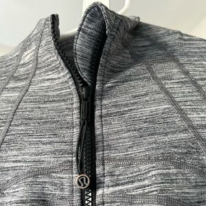 Lululemon zip up jacket. Good condition, slight discoloration on zipper.